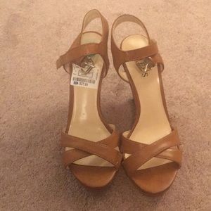 Guess brown wedge strappy sandals.